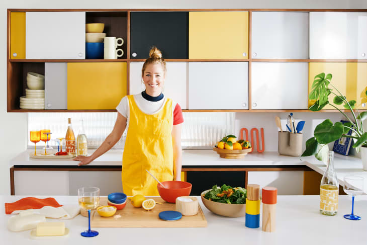 Molly Baz x Crate &amp; Barrel tools launch: Molly Baz in colorful kitchen with all her new tools around her