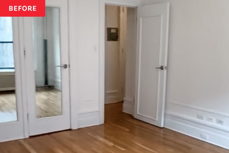 Empty white bedroom before renovation into shared kids room.