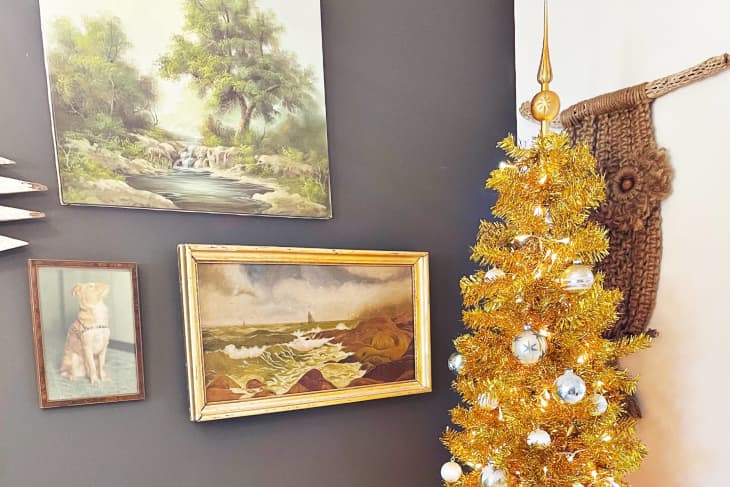 Gold Christmas tree in corner of apartment.