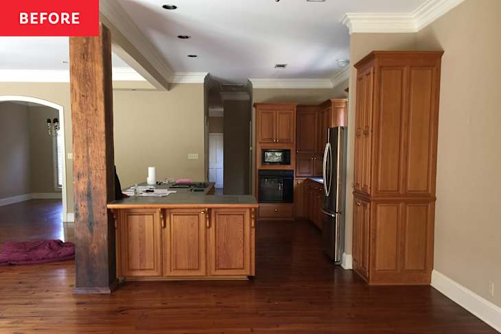 Wooden cabinets in kitchen before renovation.