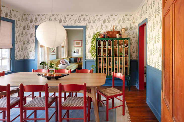 Dining room with blue and white walls and red accents