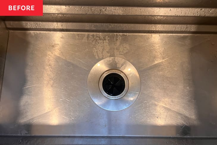 Stainless steel kitchen sink before cleaning.