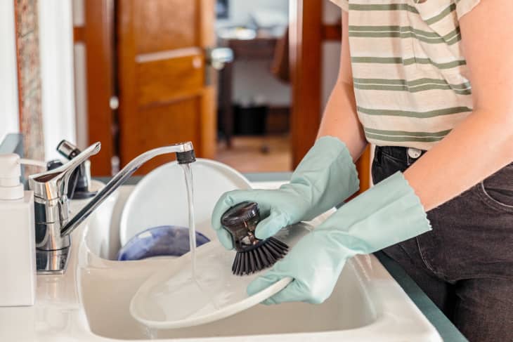 Woman washing dishes