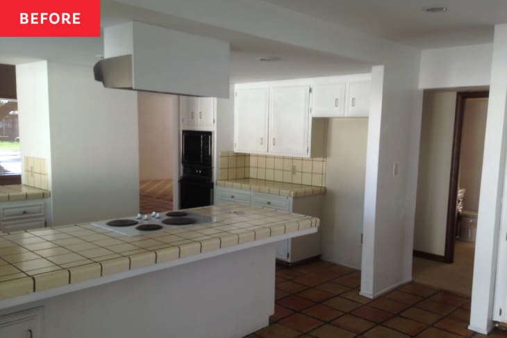 White kitchen with light tile before renovation.