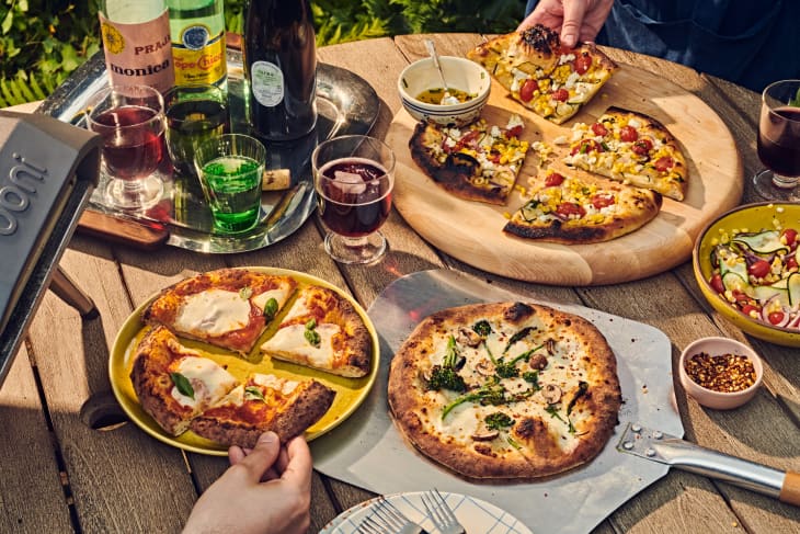 multiple pizzas on a table