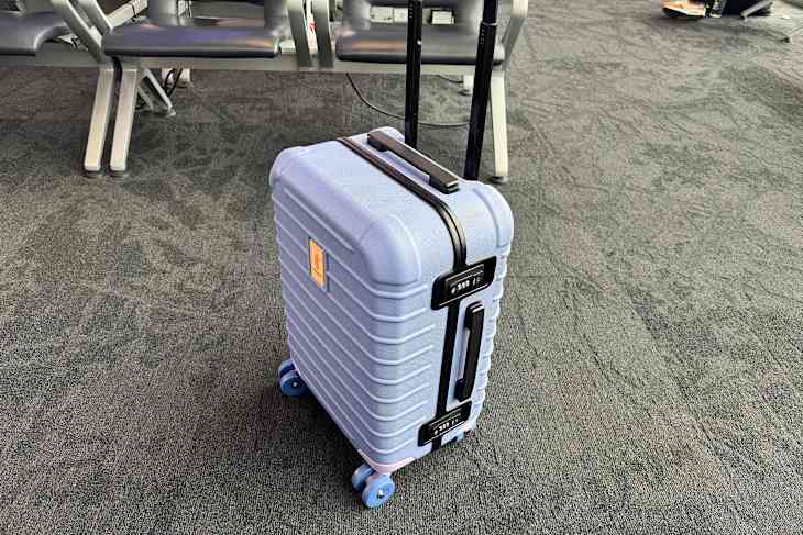 Cotopaxi hardcover suitcase.