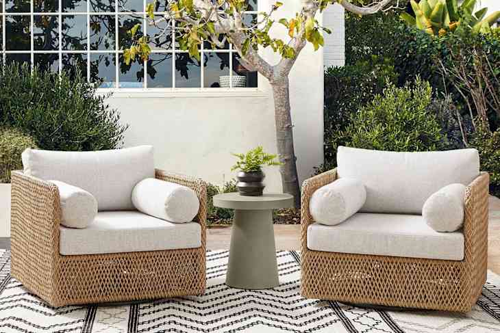 2 west elm rattan and white chairs outside
