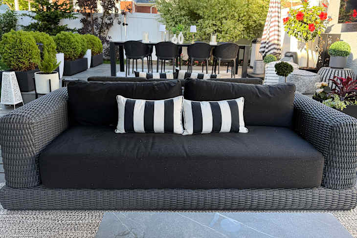 Neighbor Roundabout Sofa on someone's back patio