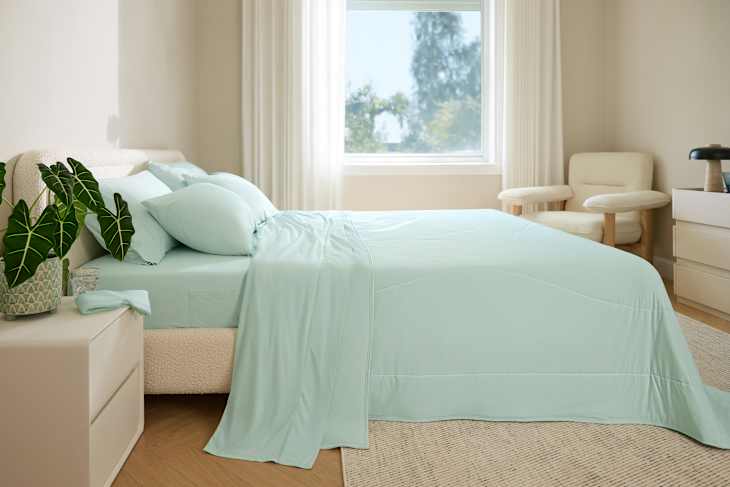 Breescape cooling sheets on bed in sunny bedroom