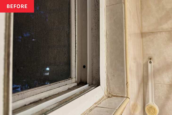 Dirty bathroom window before cleaning.