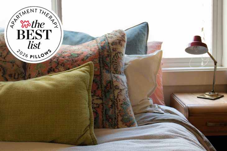 Bed with a lot of pillows and best list seal in upper left