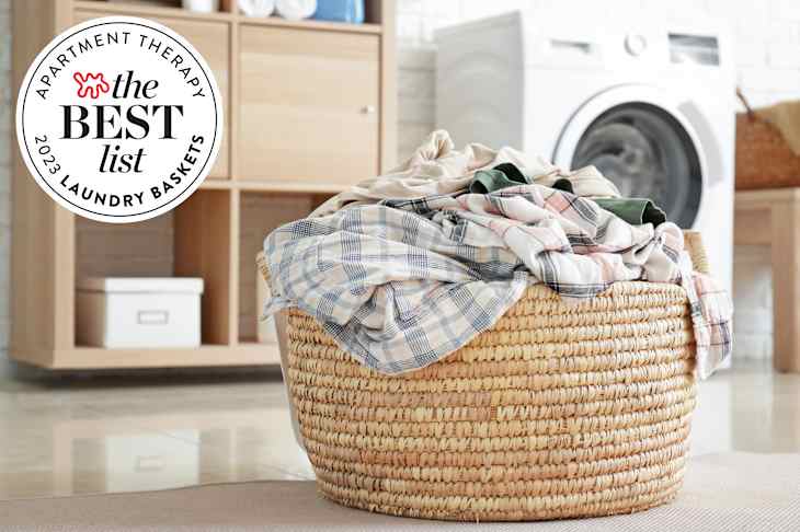 Basket with dirty laundry on floor in bathroom with best list seal in corner