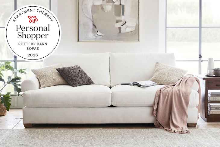 white living room with white pottery barn sofa and personal shopper seal in upper left