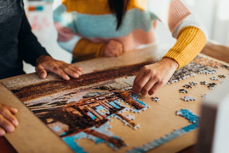 Two people doing puzzle