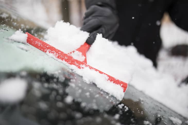 Cleaning car windshield from snow