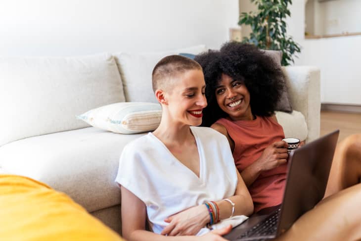 2 female friends on a laptop at home