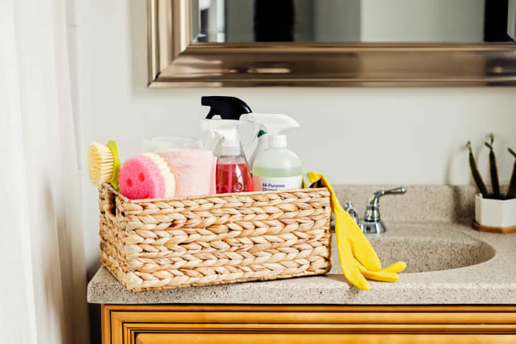 Spray Bottle And Cleaning Tools On The Kitchen Countertop. Basket