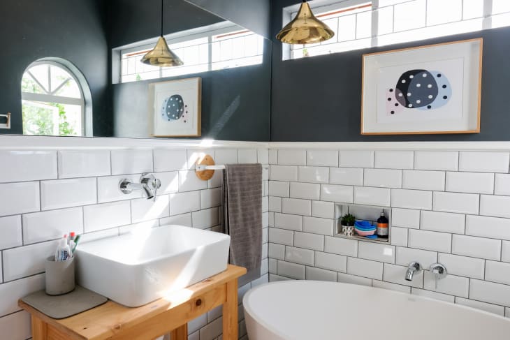 A small bathroom with subway tile.