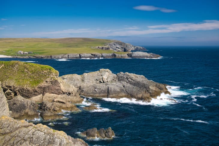 Steeply inclined eroded rock strata on Funzie Ness on the island of Fetlar in Shetland, Scotland, UK - Rocks in this area are of the Muness Phyllites Formation - Metaconglomerate - metamorphic bedrock