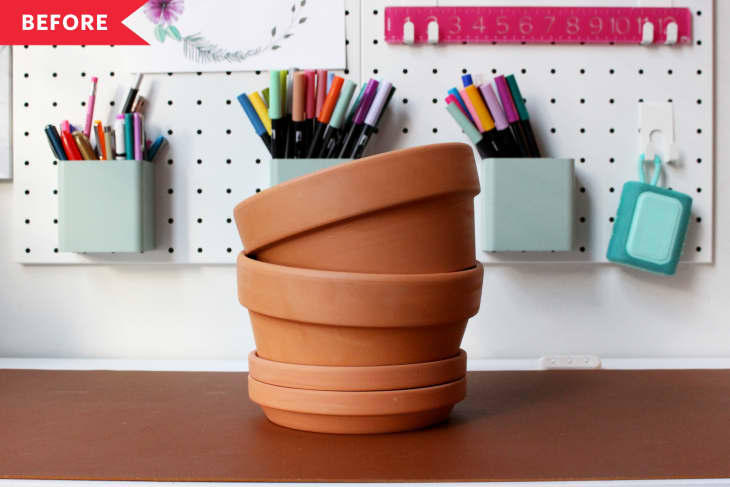 Before: stack of plain terracotta pots and saucers