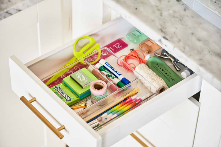 Looking inside an organized kitchen junk drawer