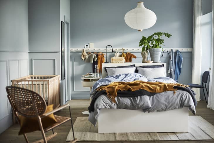 Ikea small space bedroom with teal walls and multifunctional furniture