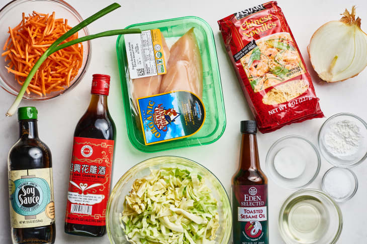 Ingredients for Chow Mein including chicken, noodles, cabbage, carrots, soy sauce, and sesame oil.