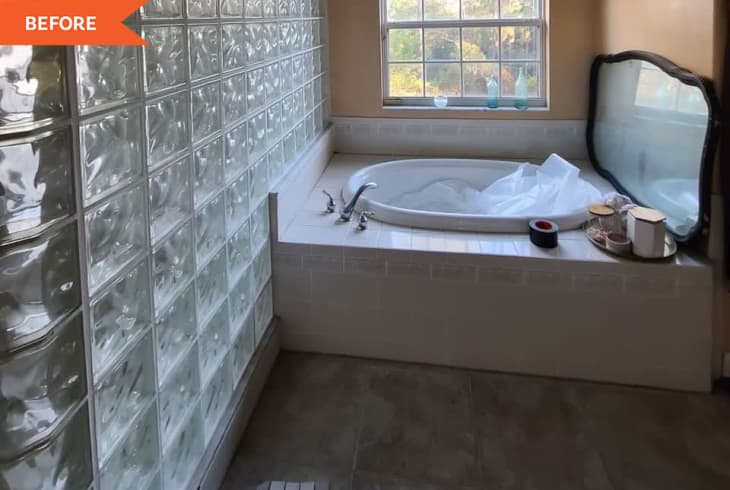 Before: Bathroom with tan walls, beige tile floor, a corner bathtub, and a walk-in shower surrounded by glass blocks