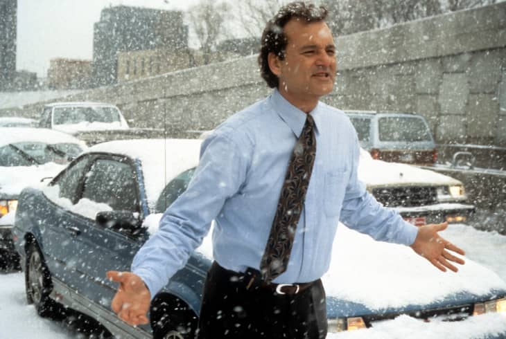 Bill Murray runs through the snow in a scene from the film 'Groundhog Day', 1993.