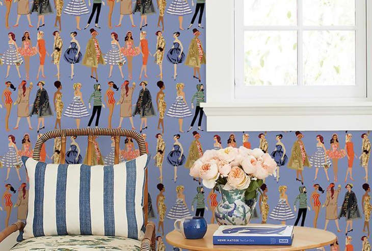 Chair and side table in front of vintage Barbie wallpaper