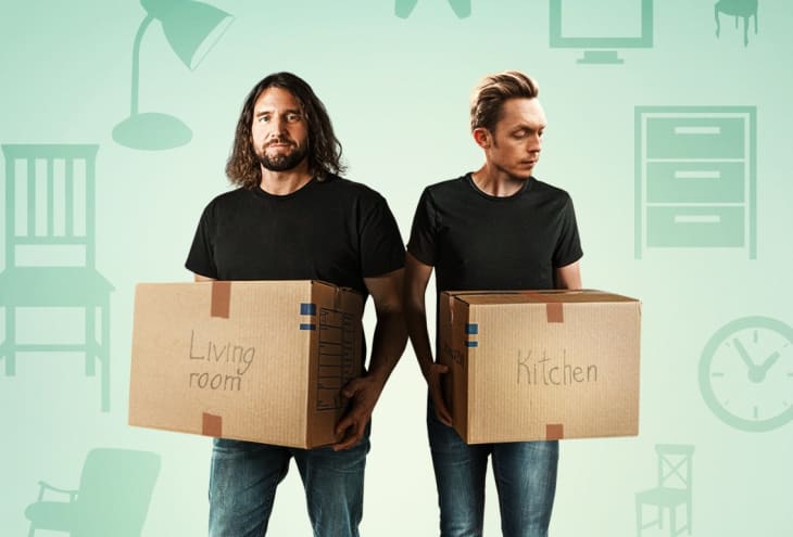 Two men holding labeled moving boxes, one for the living room and one for the kitchen, with furniture icons in the background.