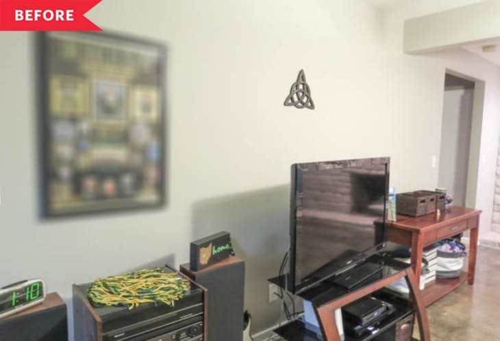 Before: beige TV wall with mismatched furniture