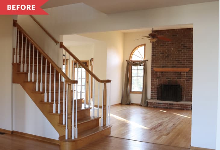 empty living room brick fireplace