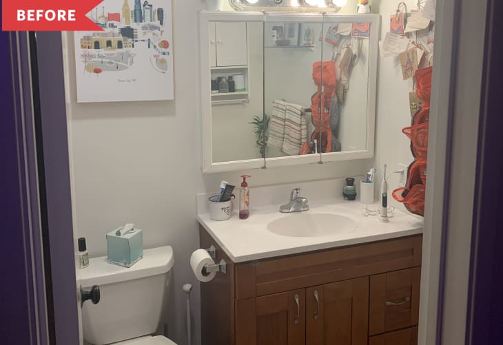 Before: White bathroom with stained wood vanity