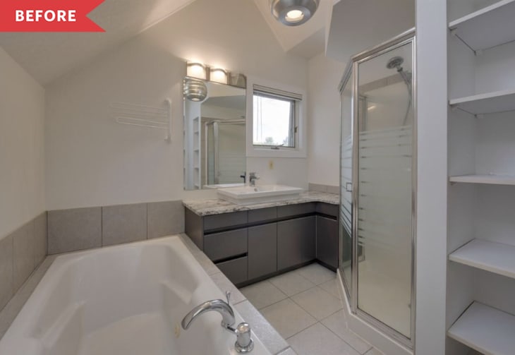 Bathroom with a large bathtub, glass shower, dark vanity, and open shelving.