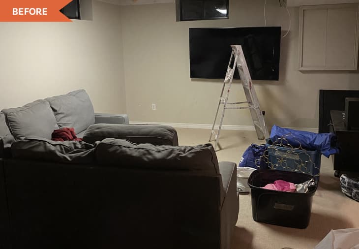 Before: Cluttered basement with beige walls and carpet
