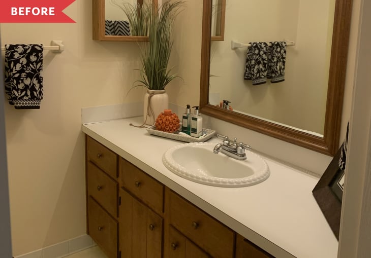 Before: bathroom with yellowy walls and wood vanity with white countertop