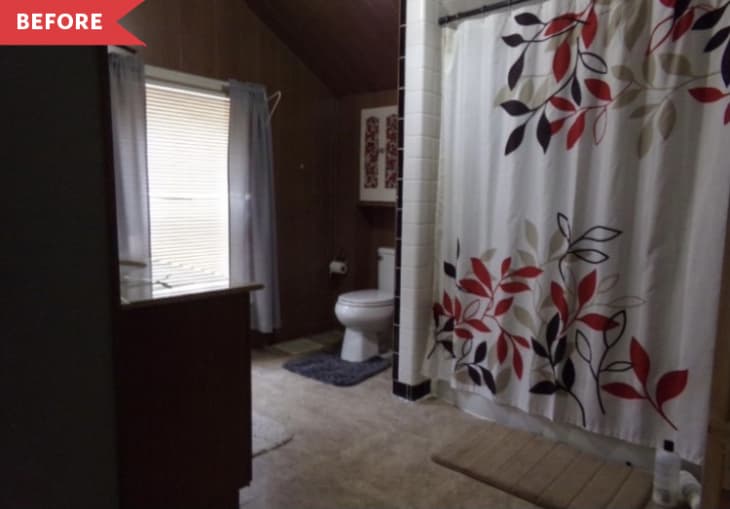Before: Dark bathroom with tan floors, wood-paneled walls, and white floral shower curtain