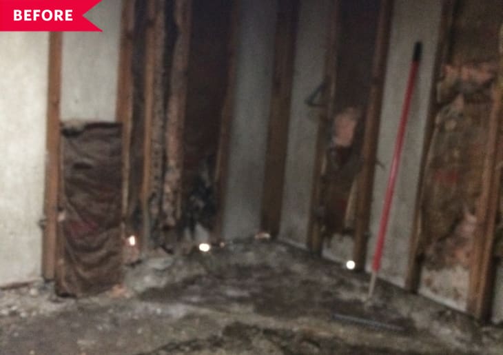 Before: Totally unfinished living room with crumbling dirt and concrete floors