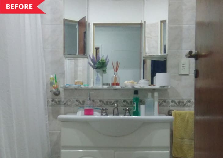 Before: Bathroom with outdated vanity and mirror