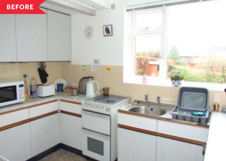 Before: Dated kitchen with white cabinets and tan tile
