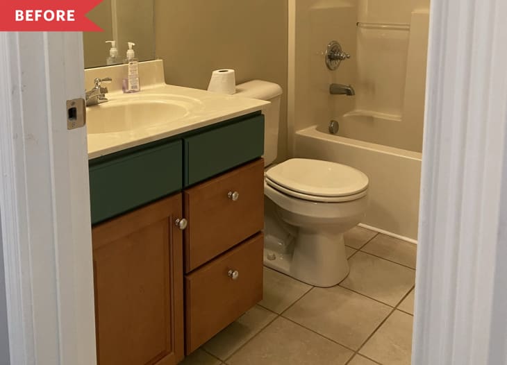 Before: Bathroom with beige tile floors, beige walls, and a wood and green-painted vanity