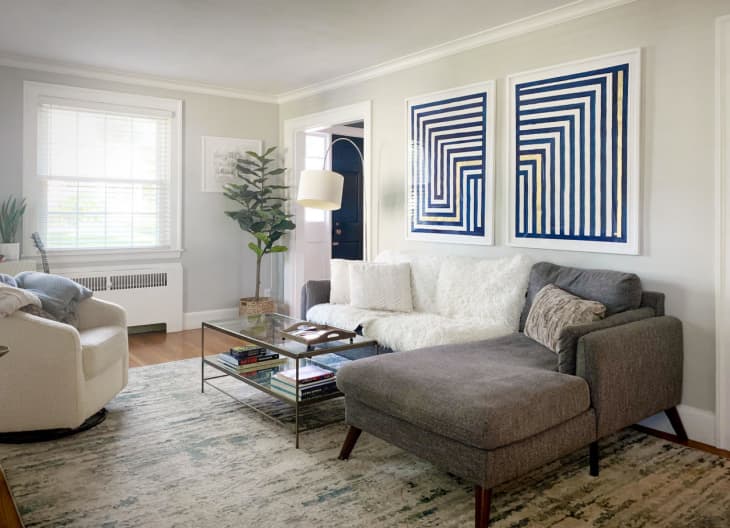 Erin Derby's DIY indigo and gold leaf striped art about a sofa in a living room