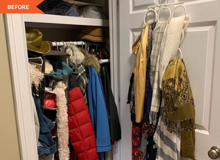 Cluttered closet with various coats, hats, and scarves hanging on the door.