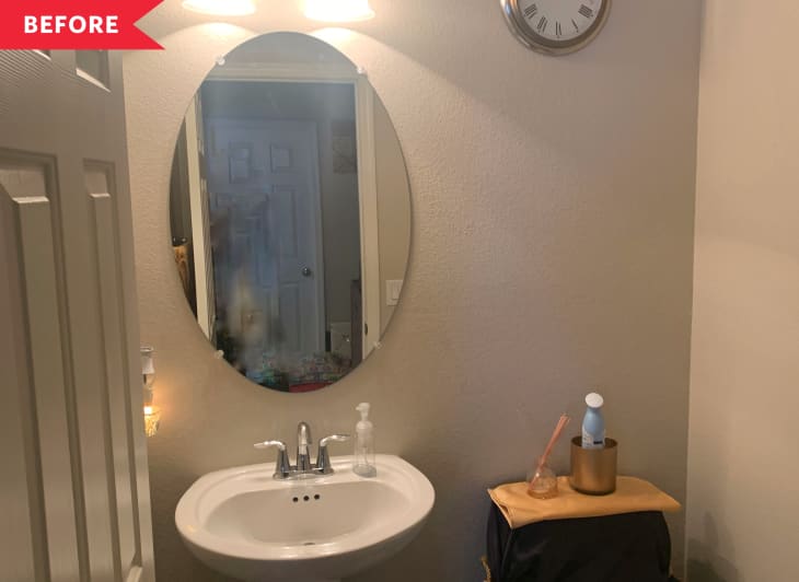 Before: tan bathroom with oval mirror and builder-grade fixtures