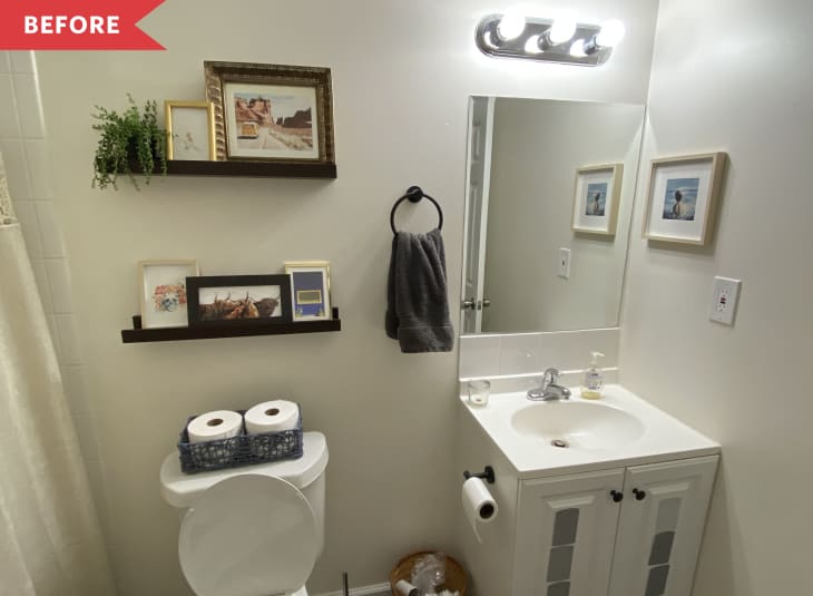 beige bathroom with white vanity and small vanity light