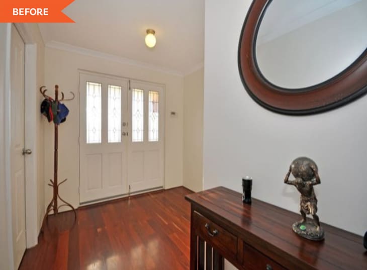 Before: a white entryway with white doors
