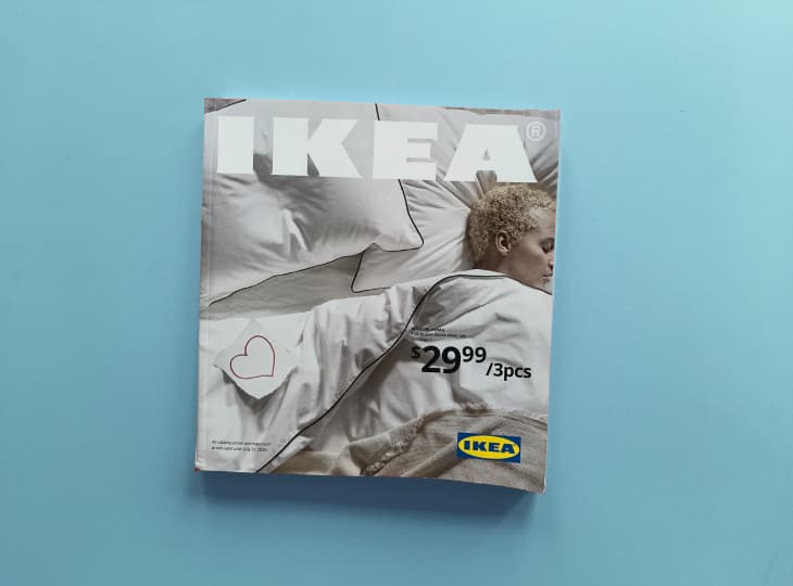 IKEA catalog cover featuring a person sleeping on white bedding, priced at $29.99 for 3 pieces.