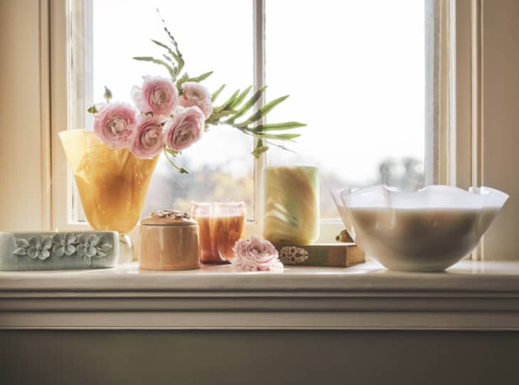 multicolored floral decor pieces on window sill
