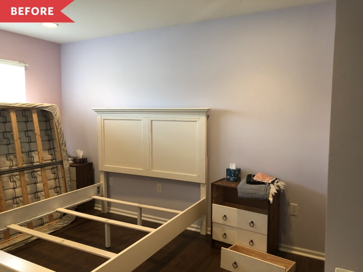 Bedroom with unassembled bed frame, headboard, and nightstand with tissues and folded clothes.